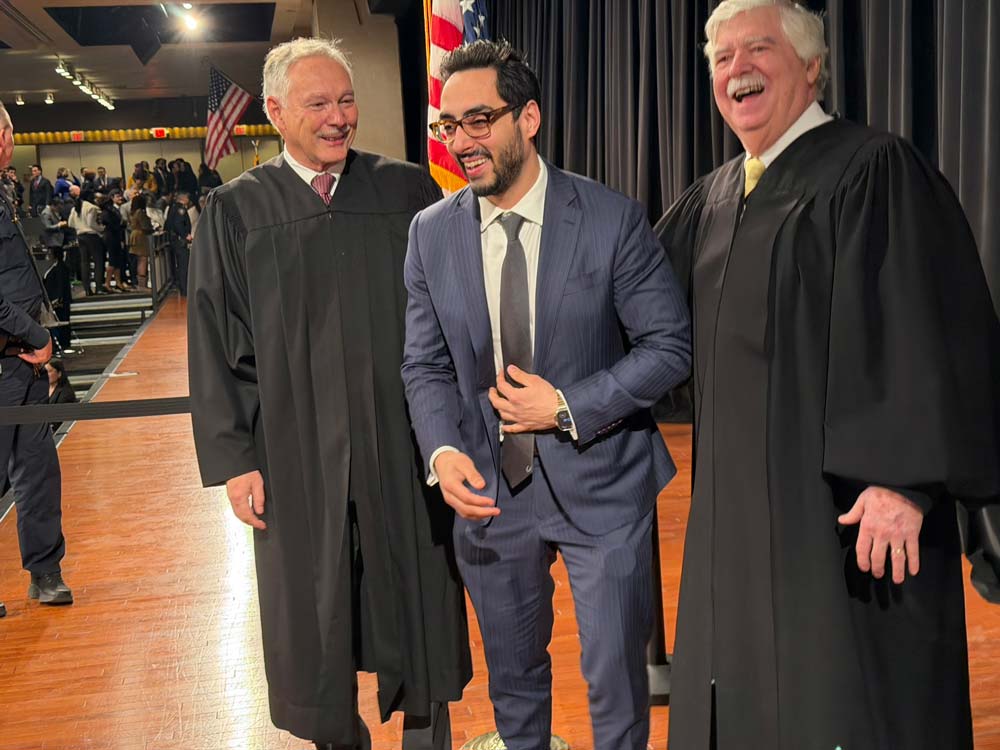 Candid photo of Shawn Lowe Desai sharing a laugh with two judges